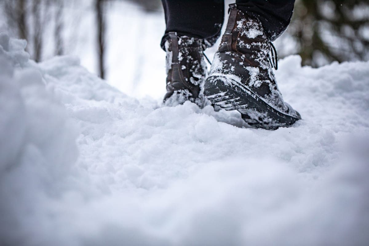 Boots walking through fresh snow